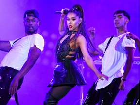 FILE - In this June 2, 2018 file photo, Ariana Grande, center, performs at Wango Tango in Los Angeles. Grande won her first Grammy Award on Sunday, Feb. 10, but the singer didn't collect it after she decided to skip the ceremony following a public dispute with the show's producer. She won best pop vocal album for "Sweetener," beating Taylor Swift, Kelly Clarkson, Pink, Shawn Mendes and Camila Cabello in the category. Grande was not in attendance at the pre-telecast ceremony, but she wrote on Twitter that her win was "wild and beautiful."