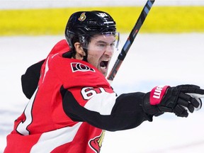 Happier Days: Ottawa Senators' right wing Mark Stone celebrates a teammate's goal against the Chicago Blackhawks during first period NHL hockey action in Ottawa on Thursday, Oct. 4, 2018.