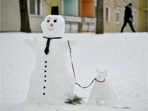 A snowman and its snowdog.