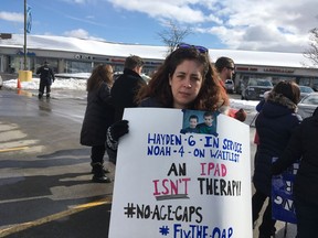Dana Williams, the mother of two children with autism, was among dozens of parents protesting changes to autism support at a third rally in as many weeks at the Barrhaven constituency office of Social Services Minister Lisa MacLeod on Friday.