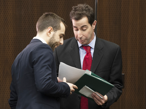 Chair Anthony Housefather speaks with an aide before a meeting of the Commons Justice Committee in Ottawa, Feb. 13, 2019.