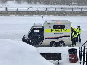 Ottawa paramedics on skates help an injured Winterluder into the service's specialized ATV Saturday for transport to the 'Fifth Avenue Shack,' the paramedics' term for a treatment centre set up near the Canal. There were a number of falls on the Skateway but no serious injuries reported.
