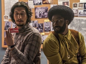 This image released by Focus Features shows Adam Driver, left, and John David Washington in a scene from "BlacKkKlansman." The film is nominated for an Oscar for best picture. The 91st Academy Awards will be held on Sunday.