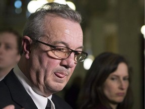 Randy Hillier, MPP for Lanark—Frontenac—Kingston, speaks with journalists outside the Ontario Legislature on Tuesday after he was suspended from caucus indefinitely by Premier Doug Ford.