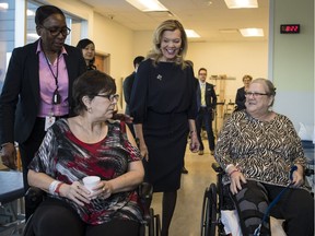 Christine Elliott, deputy premier and minister of Health and Long-Term Care, greets patients at Bridgepoint Active Healthcare before making an announcement in Toronto on Tuesday, Feb. 26, 2019.