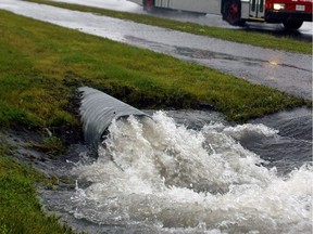 Culvert carries stormwater near the corner of St. Laurent and Innes Rd., during heavy rains.
