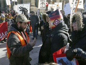 Hundreds of Pro-pipeline supporters arrived Alberta and other parts of the country in to protest against the Liberal government on Parliament Hill in Ottawa Tuesday Feb 19, 2019. Anti-pipeline supporters screaming at the Pro-pipeline supporters.