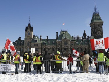 Hundreds of Pro-pipeline supporters arrived Alberta and other parts of the country in to protest against the Liberal government on Parliament Hill in Ottawa Tuesday Feb 19, 2019. Anti-pipeline supporters screaming at the Pro-pipeline supporters.