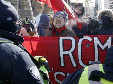 Hundreds of Pro-pipeline supporters arrived Alberta and other parts of the country in to protest against the Liberal government on Parliament Hill in Ottawa Tuesday Feb 19, 2019. Anti-pipeline supporters screaming at the Pro-pipeline supporters.