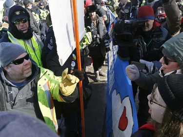 Hundreds of Pro-pipeline supporters arrived Alberta and other parts of the country in to protest against the Liberal government on Parliament Hill in Ottawa Tuesday Feb 19, 2019. Anti-pipeline supporters screaming at the Pro-pipeline supporters.