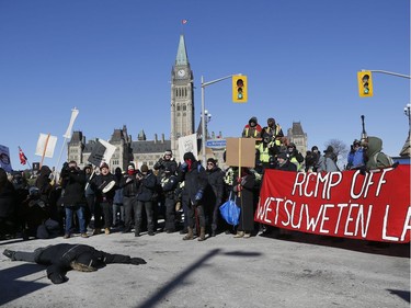 Hundreds of Pro-pipeline supporters arrived Alberta and other parts of the country in to protest against the Liberal government on Parliament Hill in Ottawa Tuesday Feb 19, 2019. Anti-pipeline supporters screaming at the Pro-pipeline supporters.