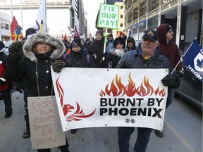 PSAC members protest the Phoenix pay system on Laurier Ave in Ottawa Thursday, Feb 28, 2019. Members demand action from the federal government because of the Phoenix pay system.