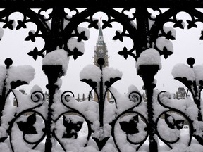 Snow covers the front gates to Parliament Hill in Ottawa.