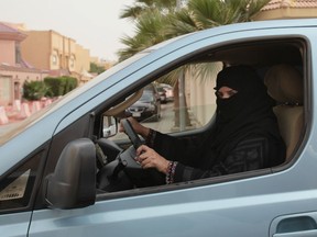In this file photo taken Saturday, March 29, 2014, Aziza Yousef drives a car in Riyadh, Saudi Arabia, as part of a campaign to defy Saudi Arabia's ban on women driving.