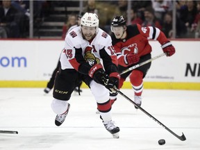 Ottawa Senators left wing Zack Smith skates with the puck against the New Jersey Devils during the first period of an NHL hockey game, Thursday, Feb. 21, 2019, in Newark, N.J.