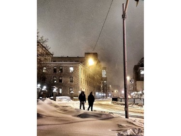 Snow covers the ground on the Transitway near the University of Ottawa campus on Tuesday evening.