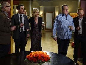 This image released by ABC shows, from left, Ed O'Neill, Ty Burrell, Sofia Vergara, obscured, Julie Bowen, Eric Stonestreet and Jesse Tyler Ferguson in a scene from "Modern Family." ABC's "Modern Family," the five-time Emmy Award winner for best comedy, will end its run next year after 11 seasons.