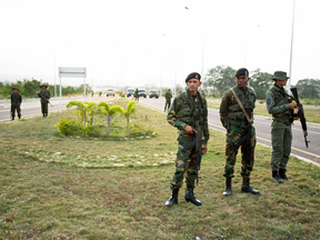 Members of the Venezuelan army and National Guard block the main access to the Tienditas International Bridge that links Colombia and Venezuela, Feb. 7, 2019.