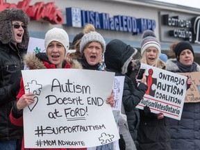 Parents protest outside MPP Lisa MacLeod's constituency office in Barrhaven claiming that the recent funding announcement for autistic children is not nearly enough. Photo by Wayne Cuddington/ Postmedia