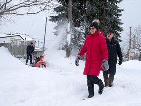 Barb and Wally Langley walk home on Hampton Ave as the city crawls out from under a major winter storm which is possibly the biggest of the season.