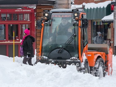 A sidewalk plow is hard at work in the Byward Market as the city crawls out from under a major winter storm which is possibly the biggest of the season.