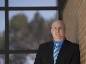 NEWMARKET, ONTARIO: May 20, 2015 - Peter Merrifield, a 17-year veteran RCMP officer who claims his superiors abused their authority and tried to drive him off the force after he ran a Conservative party nomination in 2005, poses for a portrait at the Newmarket courthouse in Newmarket, Ontario, Wednesday May 20, 2015.