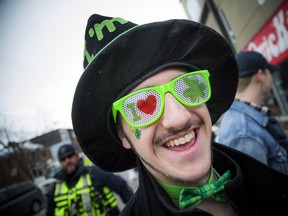 People gathered on Russell Ave in Sandy Hill Sunday March 17, 2019, to celebrate Saint Patrick's Day. Ottawa police, fire, paramedics and bylaw were all keeping a close eye on the revellers Sunday. Cody Nademi had the perfect shades for the party.   Ashley Fraser/Postmedia