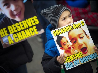 The Next Step Autism March, organized by two autism parents in Barrhaven, made its way to Parliament Hill Sunday March 30, 2019. Six-year-old Orlando Cedeno holds a sign showing support for his brother four-year-old Antonio Cedeno (not pictured).