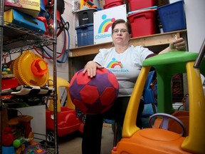 Brenda Reisch, Executive Director of Children at Risk (a charity that helps autistic children and their families) sits in the toy store room at their Ottawa offices March 7, 2019.  She is worried about the fate of the charity's summer camps for autistic children because they have not yet received confirmation of provincial funding that enables them to use public schools in the summer.