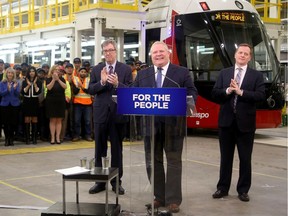 Ontario Premier Doug Ford, centre, joined Ottawa Mayor Jim Watson, left, Ontario Minister of Transportation Jeff Yurek and other local and provincial politicians at a light rail station in Ottawa to announce $1.2 billion in funding for the second stage of LRT on Friday, March 22, 2019.