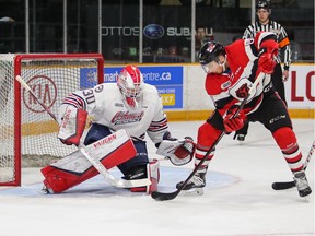 Sasha Chmelevski of the Ottawa 67's is unable to tip the puck past Oshawa Generals goaltender Aidan Hughes during an Ontario Hockey League game at TD Place arena in Ottawa on March 9, 2019. Oshawa won the game 3-2.