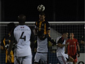 Charleston Battery captain Taylor Mueller (top) jumps over Kevin Oliveira of Ottawa Fury FC to head the ball during a United Soccer League Championship game at Charleston, S.C., on Saturday March 9, 2019. The game ended in a 1-1 draw.