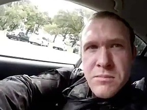 TOPSHOT - This image grab from a self-shot video that was streamed on Facebook Live on March 15, 2019 by the man who was involved in two mosque shootings in Christchurch shows the man in his car before he entered the Masjid al Noor mosque. - A "right-wing extremist" armed with semi-automatic weapons rampaged through two mosques in the quiet New Zealand city of Christchurch during afternoon prayers on March 15, killing 49 worshippers and wounding dozens more.