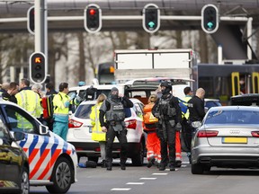Emergency services stand at the 24 Oktoberplace in Utrecht, on March 18, 2019 where a shooting took place. Robin van Lonkhuijsen / ANP / AFP