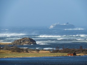 The cruise ship Viking Sky is pictured on March 23, 2019 near the west coast of Norway at Hustadvika near Romsdal. - Viking Sky has launched an SOS as it os drifting towards land.
