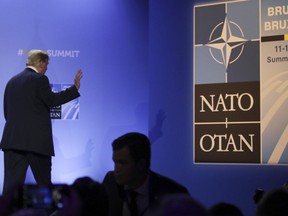 U.S. President Donald Trump leaves after a press conference at the end of a summit of heads of state and government at NATO headquarters in Brussels, Belgium, Thursday, July 12, 2018.