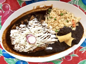 Chicken enchiladas, rice and mole at Chilaquiles