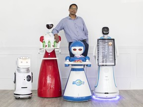 Ian McGowan CEO of Autonetics Universe is pictured with robots, left to right, 'Sanbot Nano' 'Beauty' 'Loloita' and 'Amy Plus' at Rap Riderz Innovation Centre in Aurora, Ont. on Wednesday, March 20, 2019.