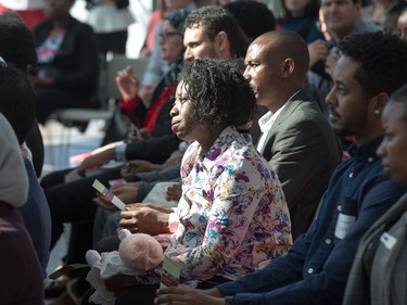 New Canadians listen to speeches as the Institute for Canadian Citizenship, together with Immigration, Refugees and Citizenship Canada, and the National Gallery of Canada, held a special community citizenship ceremony in the Great Hall at the National Gallery of Canada.