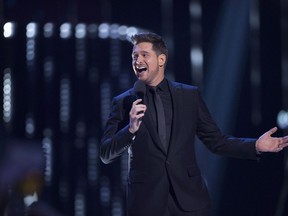 Host Michael Buble is shown on stage at the Juno Awards in Vancouver on March, 25, 2018. Canadian crooner Michael Buble is set to revisit the hits of his musical career in a multi-network special on Wednesday. The one-hour show will air at 10 p.m. on Rogers-owned Citytv as well as Bell's CTV and online streaming service Crave.