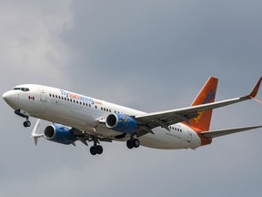 Files: A Sunwing Boeing 737-800 passenger plane prepares to land at Pearson International Airport in Toronto on Wednesday, August 2, 2017.