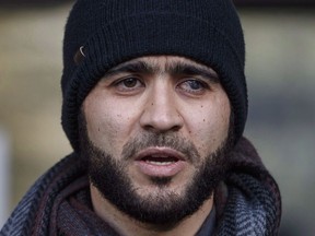 Omar Khadr speaks outside court in Edmonton on Thursday, December 13, 2018. An Alberta judge is expected to rule today on whether a war crimes sentence for former Guantanamo Bay prisoner Khadr should be declared expired.THE CANADIAN PRESS/Jason Franson