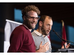 Seth Rogen, left, laughs as Evan Goldberg speaks during a Canada's Walk of Fame ceremony honouring them in Vancouver, on Friday February 15, 2019. Canopy Growth teaming up with actor Seth Rogen and Canadian screenwriter Evan Goldberg to launch a Canadian cannabis company called Houseplant.