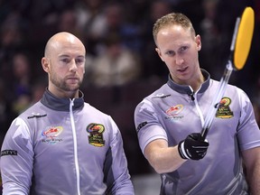 Team Jacobs skip Brad Jacobs talks with third Ryan Fry during a draw against Team Morris at the 2017 Roar of the Rings Canadian Olympic Curling Trials in Ottawa on December 2, 2017. Ryan Fry makes his return to Team Brad Jacobs for the Canadian Open Grand Slam of Curling event, which starts Tuesday in North Battleford, Sask. Fry had taken time away from curling after being kickout of a bonspiel inRed Deer. Alta., for what organizers called unsportsmanlike behaviour resulting from excessive drinking.