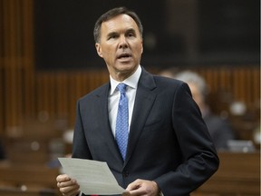 Minister of Finance Bill Morneau rises to table the federal budget in the House of Commons in Ottawa, Tuesday March 19, 2019.