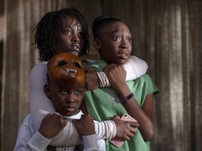 This image released by Universal Pictures shows, from left, Evan Alex, Lupita Nyong'o and Shahadi Wright Joseph in a scene from "Us," written, produced and directed by Jordan Peele.