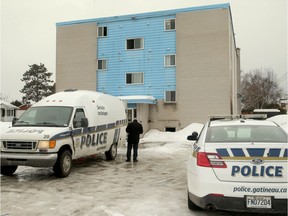 A body was discovered after an early-morning fire erupted in an apartment building at 40 Rue Robinson in Gatineau. Two people were displaced by the fire, but police remained on the scene Monday, March 11, 2019 to investigate the body found. Julie Oliver/Postmedia