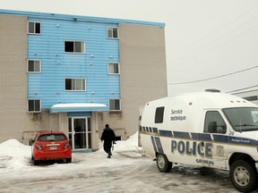 A body was discovered after an early-morning fire erupted in an apartment building at 40 Rue Robinson in Gatineau. Two people were displaced by the fire, but police remained on the scene Monday, March 11, 2019 to investigate the body found.