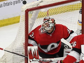 Senators goaltender Anders Nilsson follows the puck through the air after it struck the crossbar during last Thursday's home victory against the Blues.