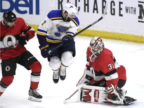 Ottawa Senators goaltender Anders Nilsson makes a pad save as St. Louis Blues left-winger Pat Maroon  jumps and Ottawa Senators defenceman Dylan DeMelo defends during the third period at the CTC on Thursday, March 14, 2019.